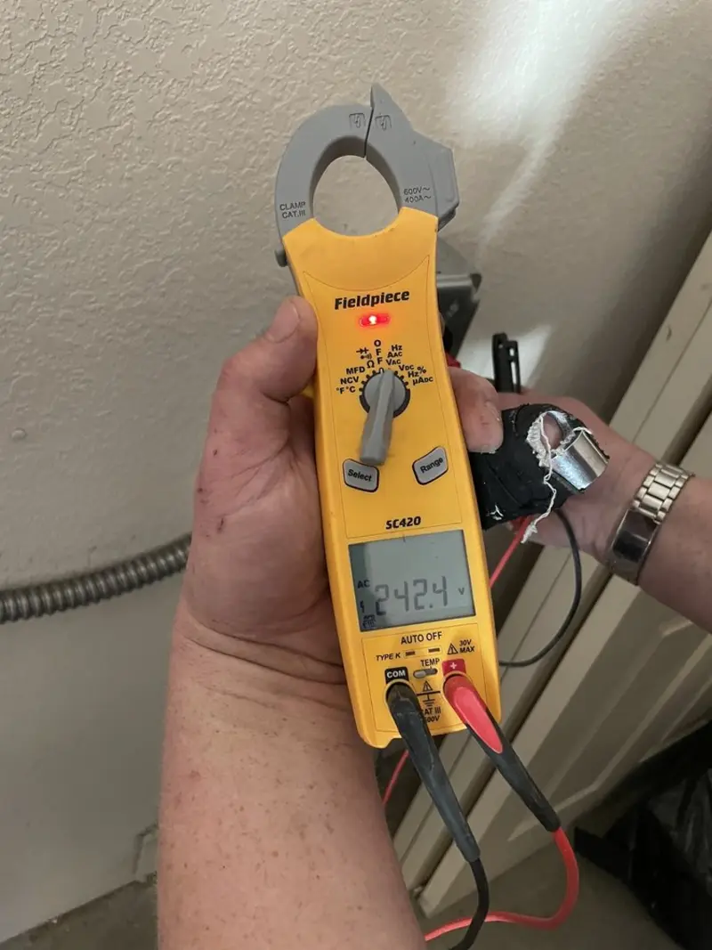 Voltage testing with clamp meter during Whole House Surge Protector in Stratham